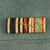 Original German WWII Named Oberleutnant der Schutzpolizei Officer's M36 Field Tunic with WWI Era Medal Bar - dated 1939 Original Items
