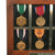 Original U.S. WWII Pearl Harbor Attack USS Vestal Bomb Fragment with Engraving & Effects of Pearl Harbor Survivor Commander Lucian Willis Bugbee Including Naval Officer’s Sword & Medals Original Items