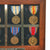 Original U.S. WWII Pearl Harbor Attack USS Vestal Bomb Fragment with Engraving & Effects of Pearl Harbor Survivor Commander Lucian Willis Bugbee Including Naval Officer’s Sword & Medals Original Items