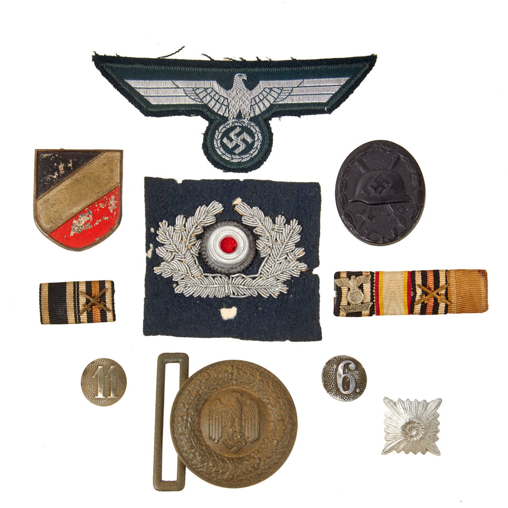 DRAFT Original German WWII Medal and Insignia Grouping with EKII 1939, KvKII with Swords, and KvKII without Swords - 9 Items (Copy) Original Items