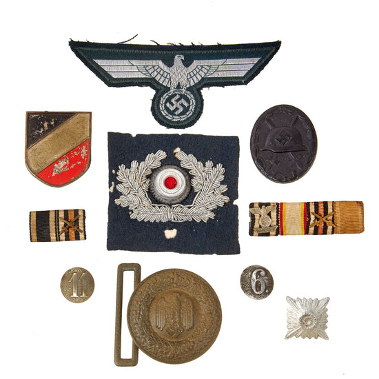 DRAFT Original German WWII Medal and Insignia Grouping with EKII 1939, KvKII with Swords, and KvKII without Swords - 9 Items (Copy) Original Items
