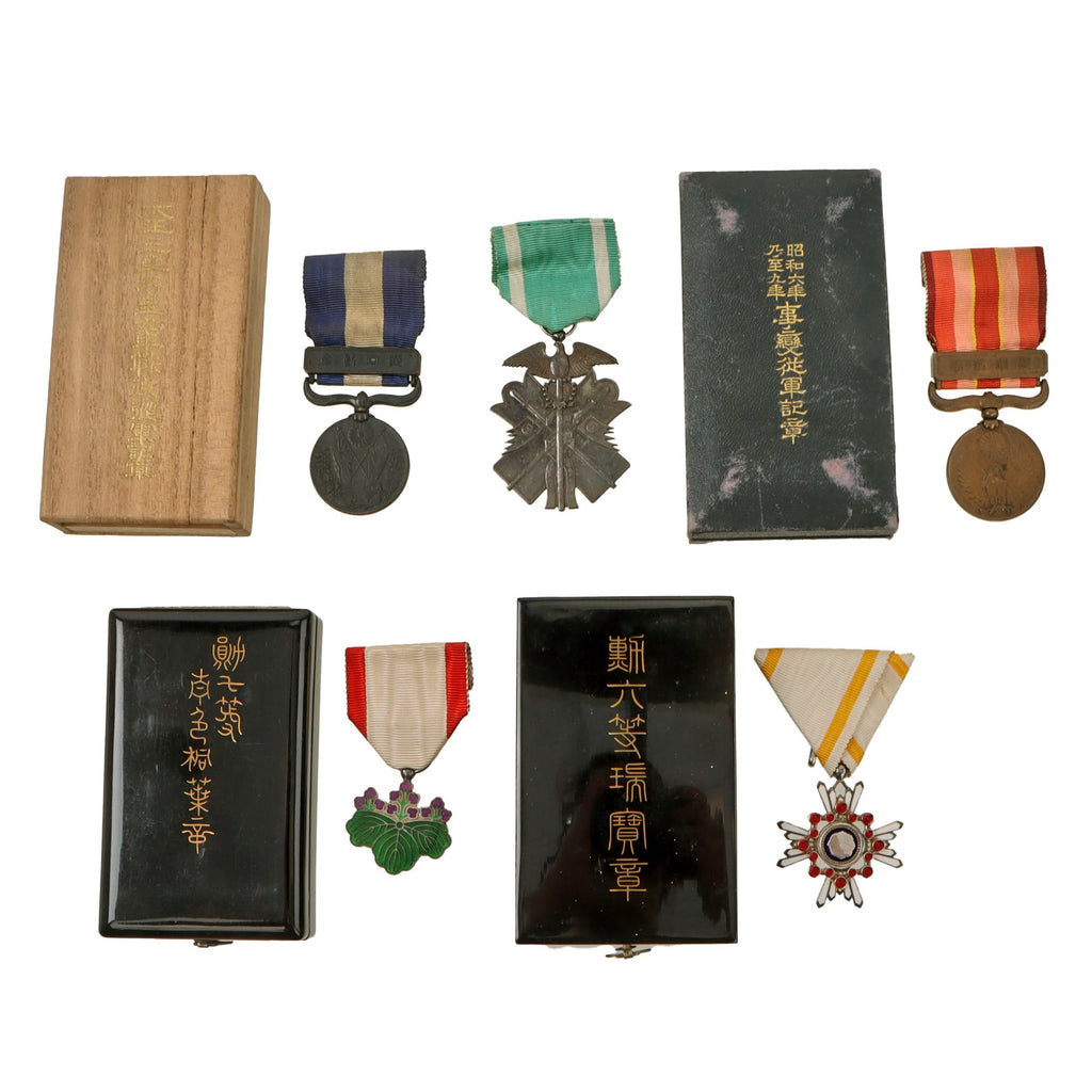 Original Japanese WWII Lot of Five Medals with Four in Original Boxes - Order of the Golden Kite, Order of the Sacred Treasure, Order of the Rising Sun, Great War Commemorative Medal, and Manchurian Incident Medal Original Items