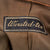 Original U.S. WWII 8th Air Force Captain Officer’s British-Made Ike Jacket with Bullion Pilot Wings on Blue “Combat Crew” Field & English-Made Bullion SSI Original Items