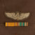 Original U.S. WWII 8th Air Force Bombardier Captain’s Ike Uniform with British-Made SSI, Ribbon Bar, & Bombardier Wings Original Items