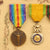 Original French WWI Named and Framed “En Memoir de la Grande Guerre” 1914-1918 Service Certificate With (4) Medals Attached Original Items