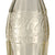 Original U.S. WWII Personal Effect Items Lot Including Sealed Bottle of 7-Up Soda, Empty Nestle’s Crunch Box, Empty Peanut Tin, & Empty Coca-Cola Bottle
