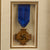 Original German WWII Framed 40-Year Gold Faithful Service Decoration with Named Award Document to Oberwachtmeister Friedrich Wilhelm Riesterer - Dated 1939 - 18” x 18”