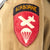 Original U.S. WWII Airborne Troop Carrier M1942 Paratrooper M42 Jump Jacket without Reinforcements with Flag Patch & Replaced Zipper and French-Made Pants with Garrison Cap Original Items