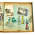 Original German WWII Personal Photo Album Featuring Artwork On Every Page and Picture of Soldier Working On Album - 26 Pictures Original Items
