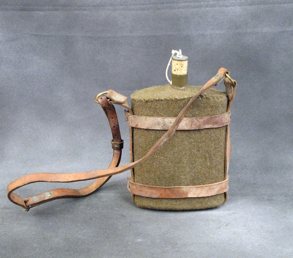 Original British Army Water Bottle in Leather Skeletal Carrier Original Items